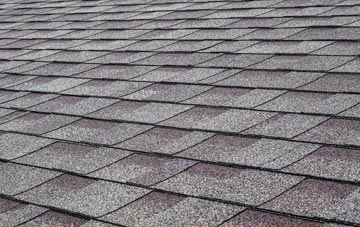 Stow tiles for shallow pitch roofing